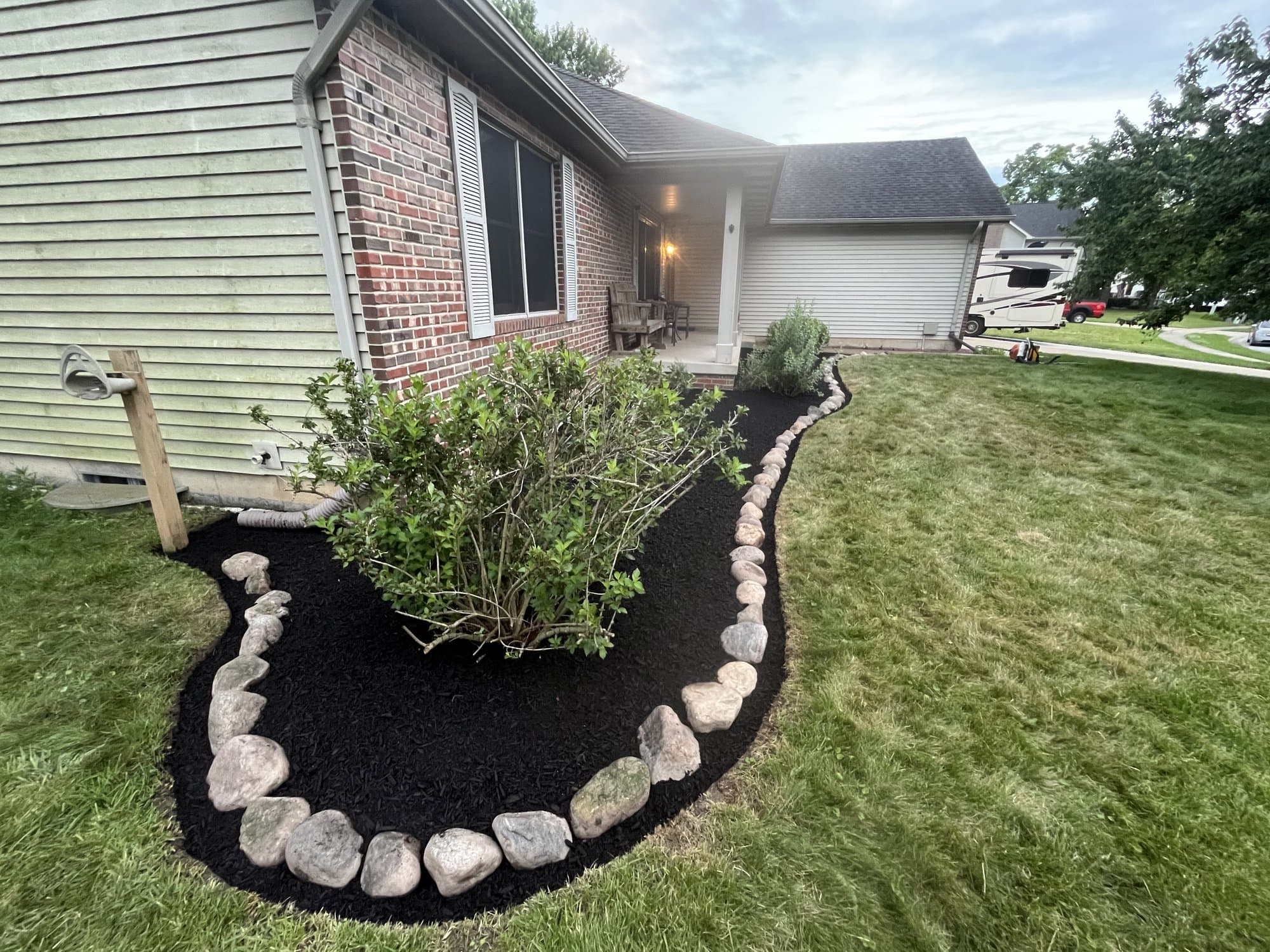 Mulch bed with river-rock border